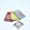 Small Quran placed inside a fabric cover.