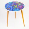 Wooden table designed with blue pattern.